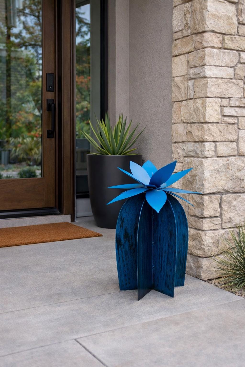 Axel Lily steel lily — front view showing lagoon blue petals and industrial steel construction